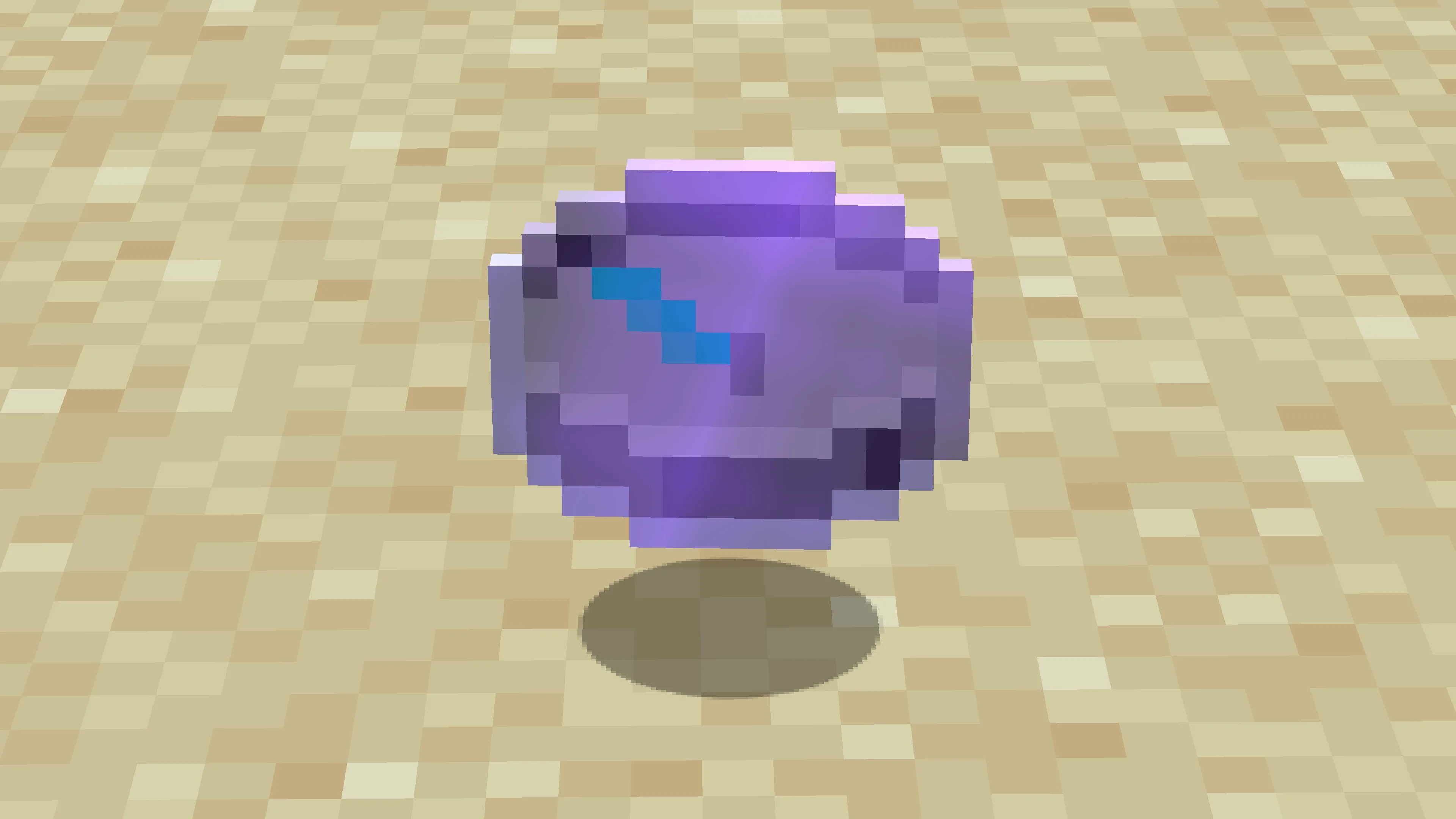 Предмет в виде монитора с чарами, лежащий на земле в Minecraft.