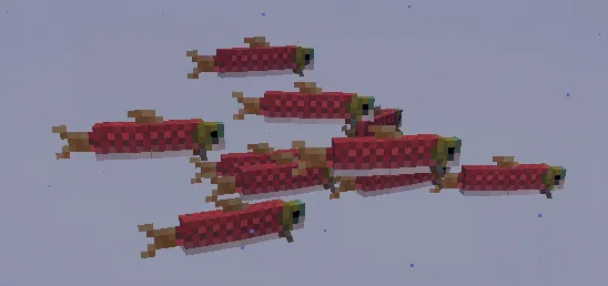 Стая рыб перед стеной из белого бетона в Minecraft.