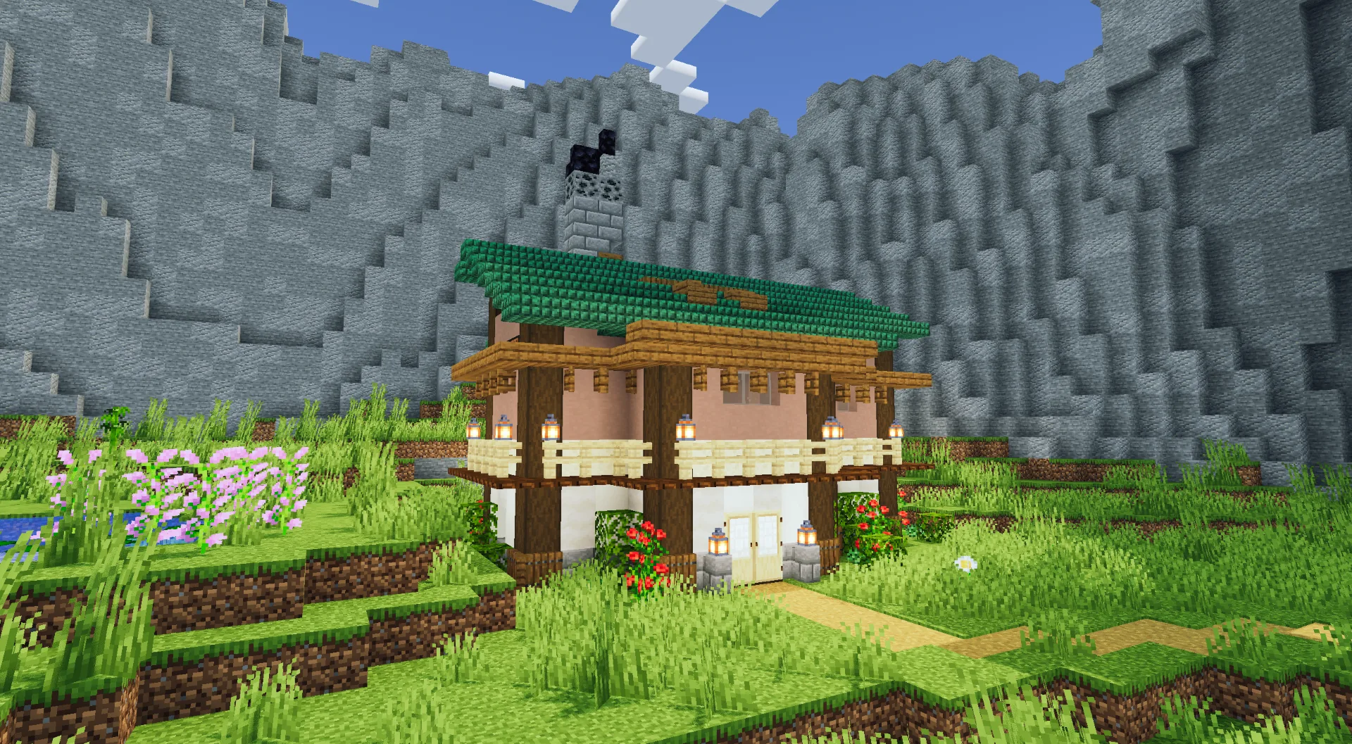 Современный дом у скалы.