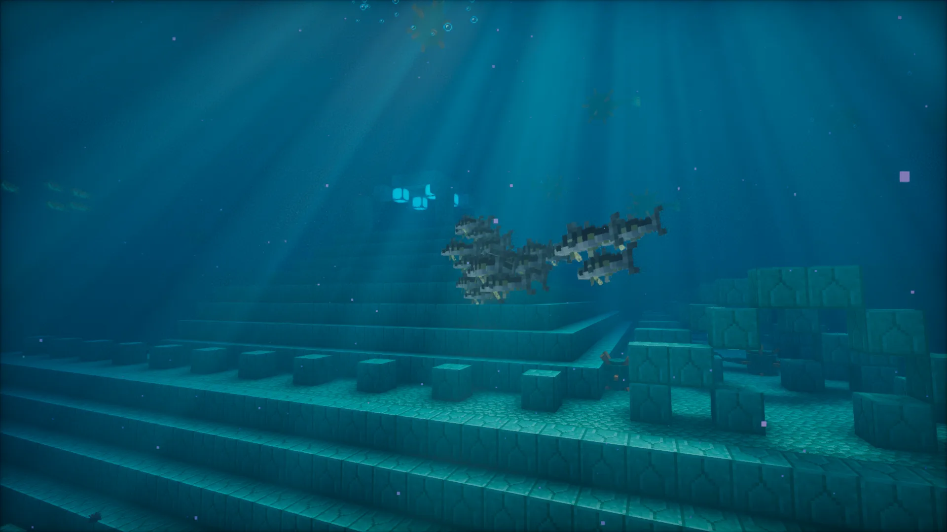 Стайка скумбрий проплывает мимо океанического монумента.