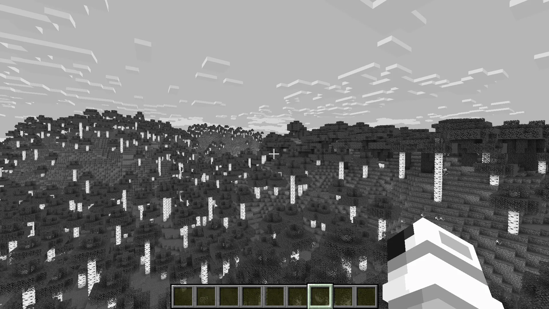 Черно-белый дом в березовом лесу.