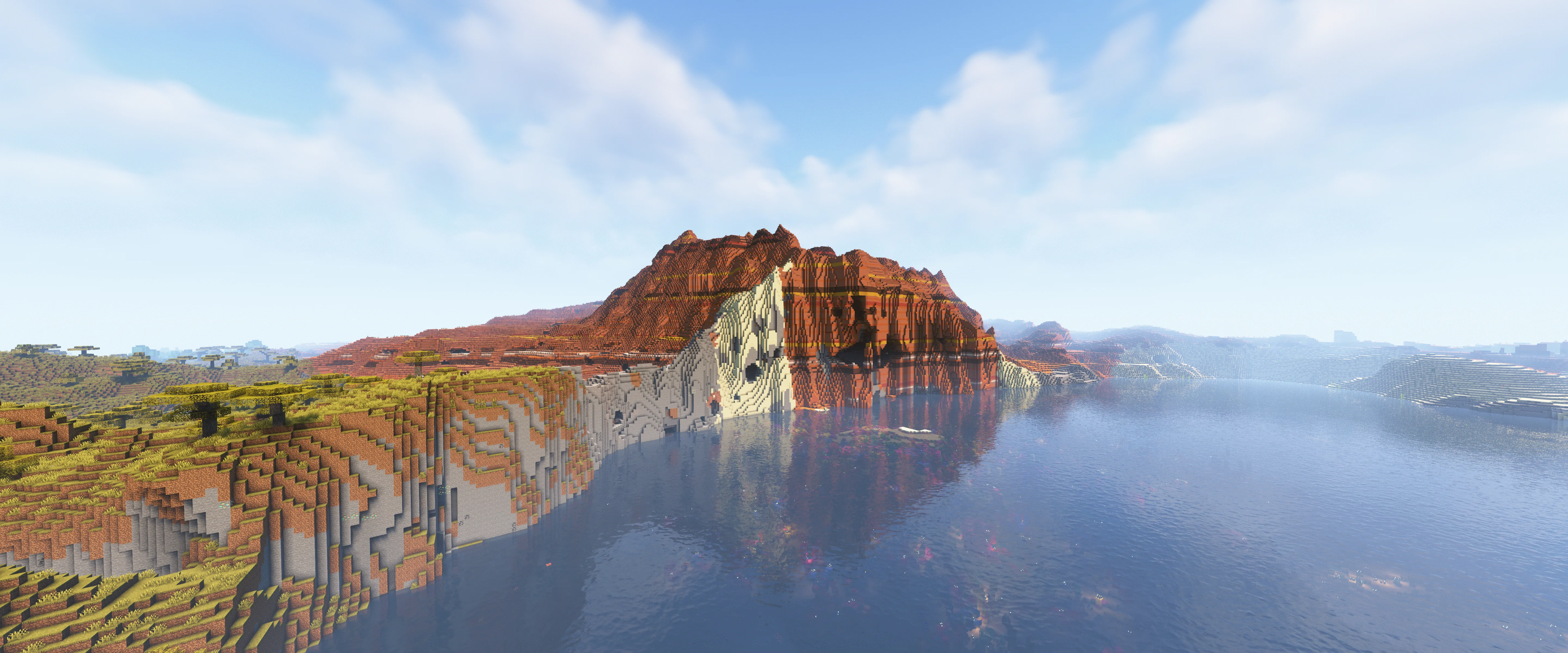 Вид на горный пейзаж с использованием шейдеров Complementary в Minecraft.