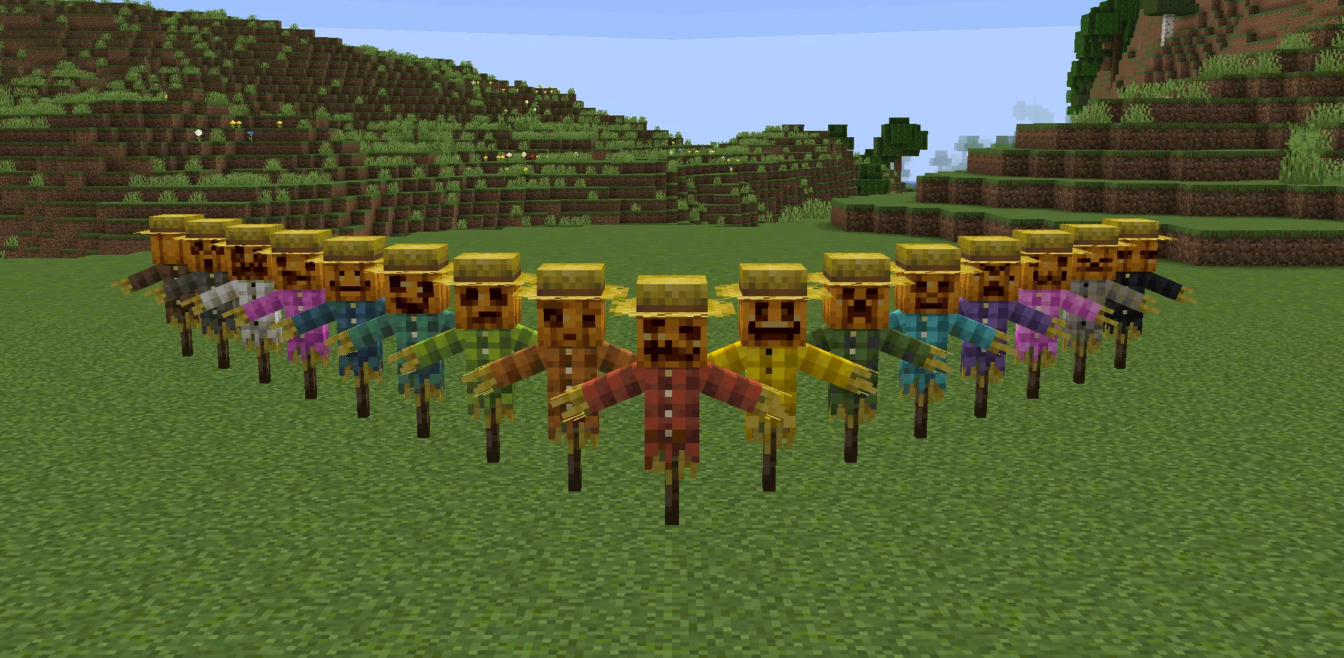 Пугало из соломы в тыквенной маске на поле.