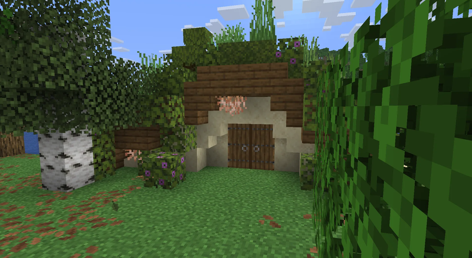 Нора хоббита из мода Thun's Structures, расположенная в биомах луга, леса и цветочного леса.