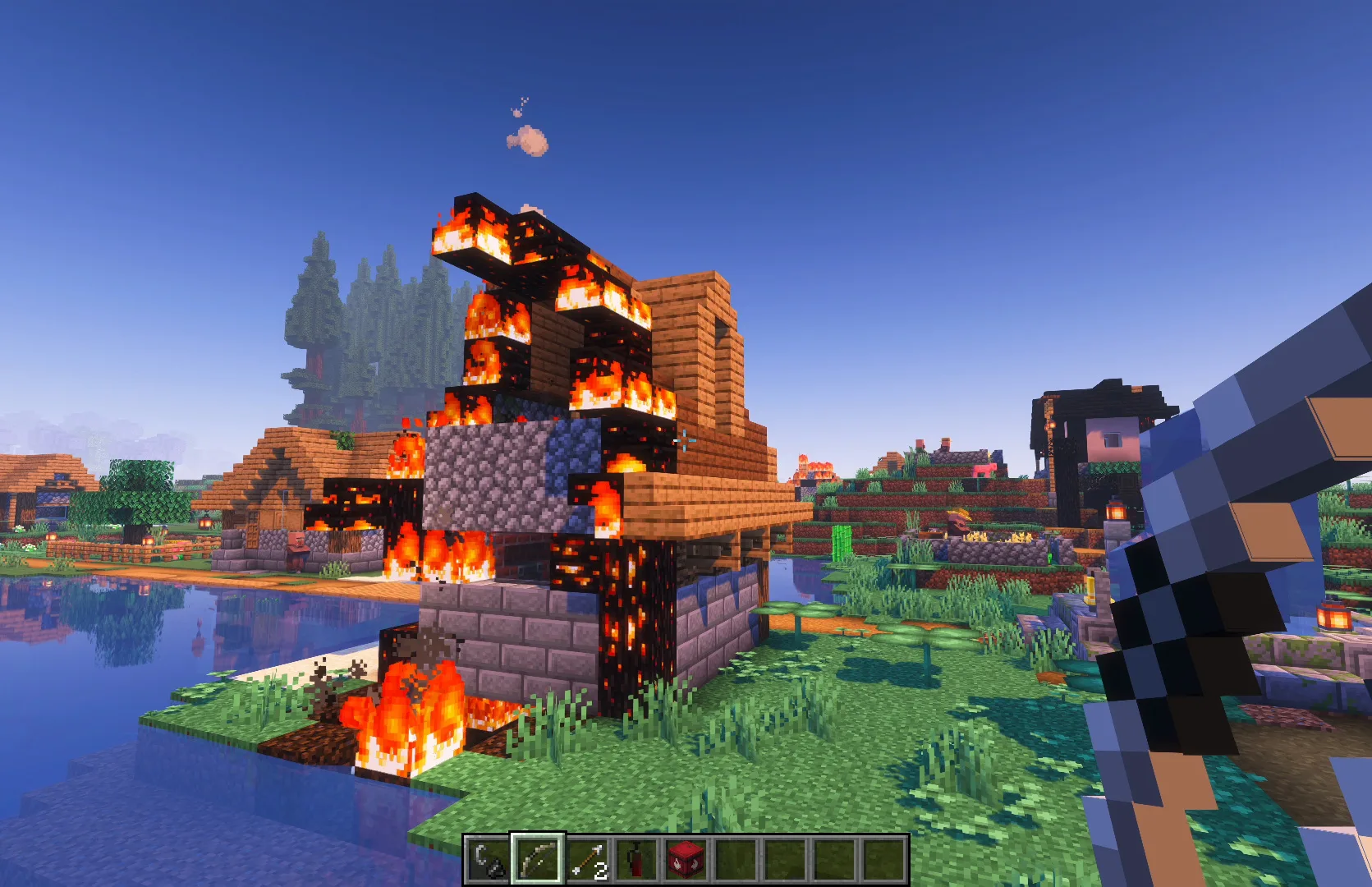 Деревня в Minecraft, охваченная огнем.