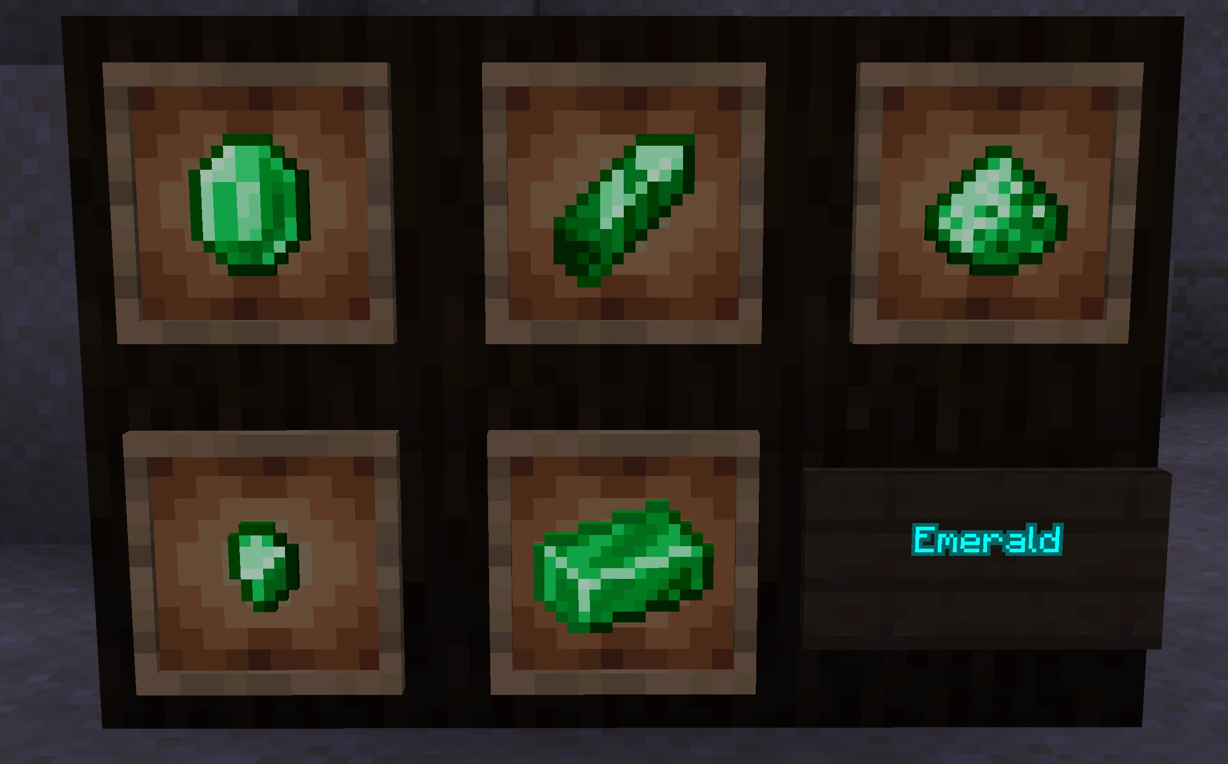 Скриншот мода Basic Materials: набор игровых предметов, изготовленных из изумрудов.
