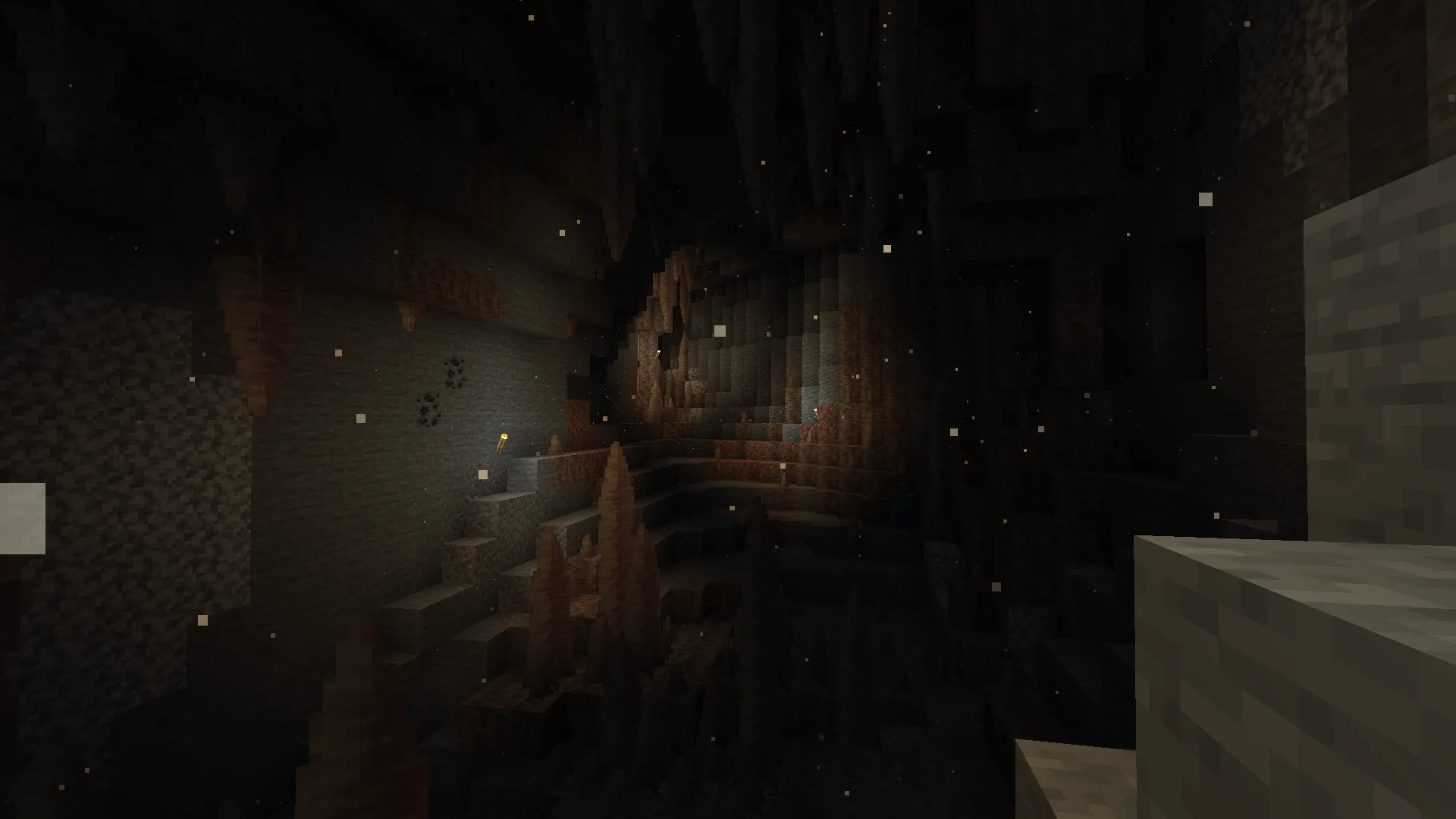 Скриншот из Minecraft с частицами пыли в пещере.