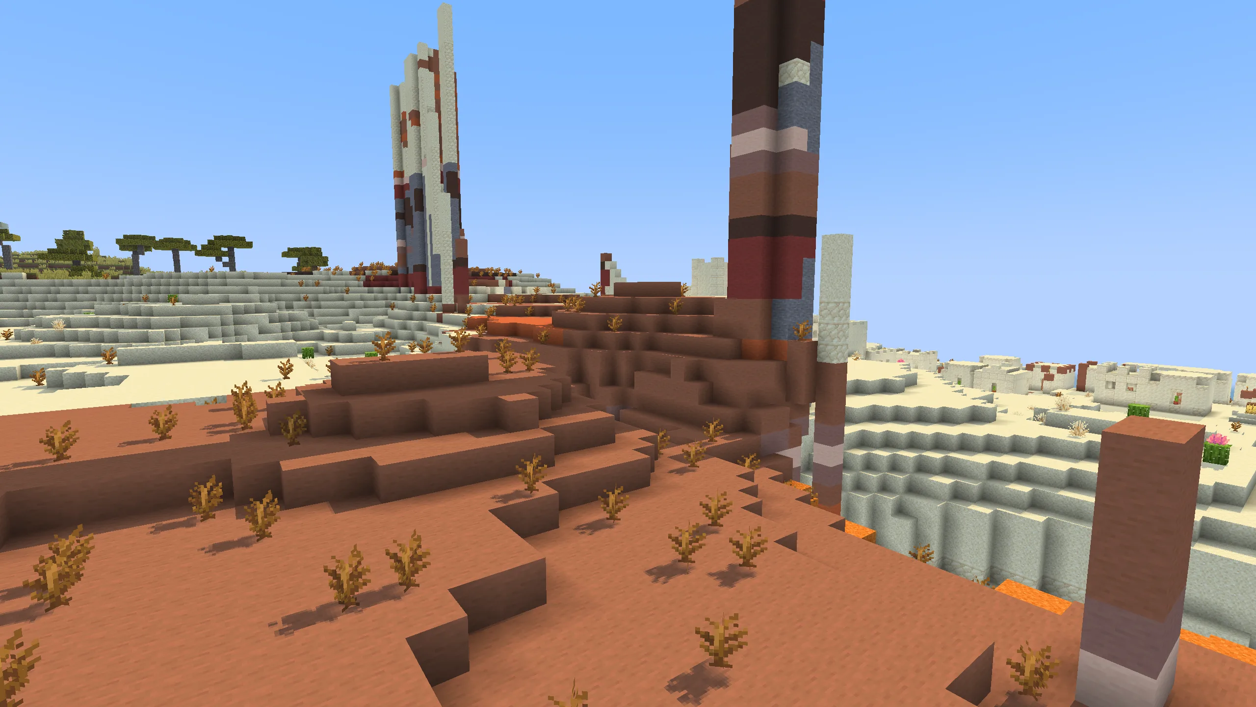 Вид на биом бесплодных земель (badlands) в Minecraft.