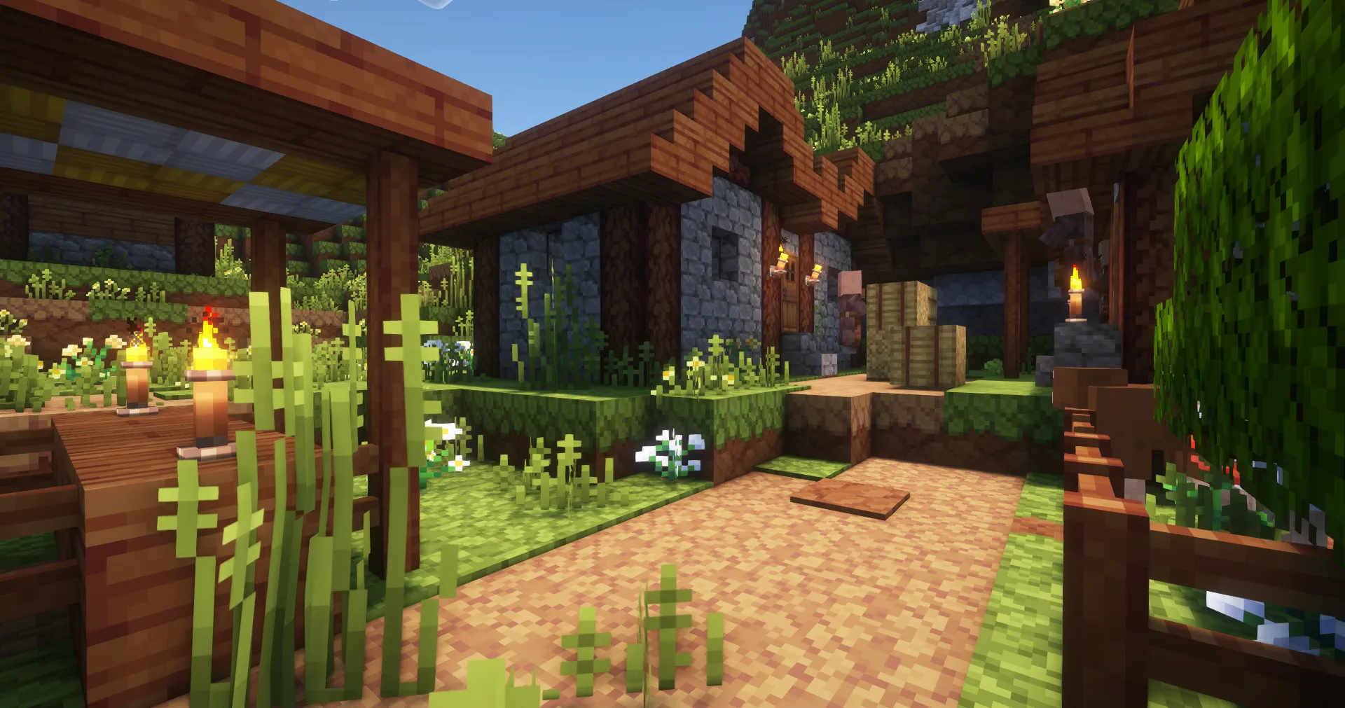 Деревня в равнинном биоме с шейдерами Complementary Reimagined и генерацией Geophilic.